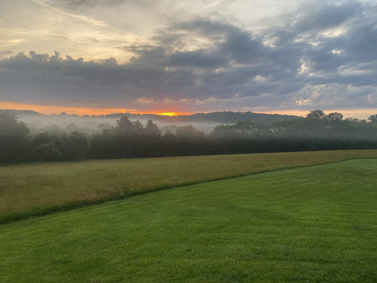 Sunrise over the Ozarks countryside at Homestead Farm Retreat & RV in Branson, Missouri